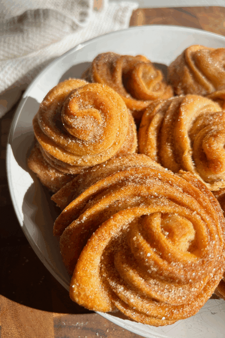 Cinnamon sugar cruffins made with crescent dough and baked in a muffin pan.